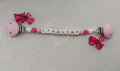 Attache doudou rose